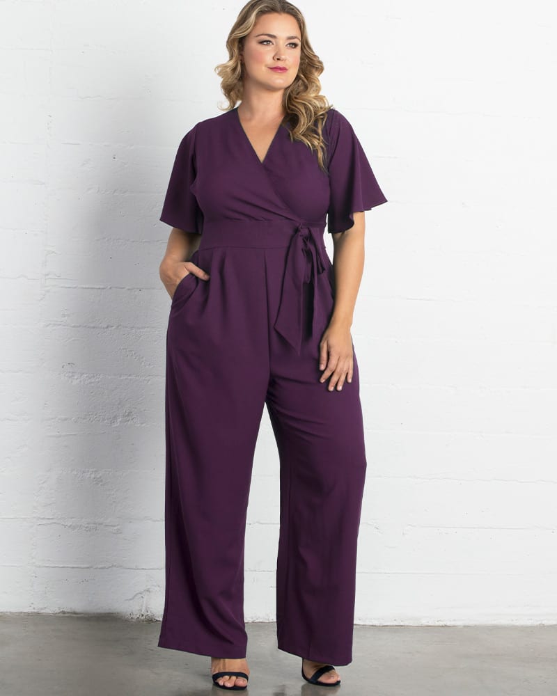 Front of a model wearing a size 0X Charisma Crepe Jumpsuit in MAJESTIC PURPLE by Kiyonna. | dia_product_style_image_id:227562